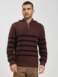 Man wearing a brown sweater with black stripes on a white background