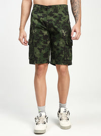 man wearing camouflage cargo shorts on a white background