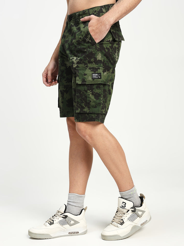 man wearing camouflage cargo shorts on a white background