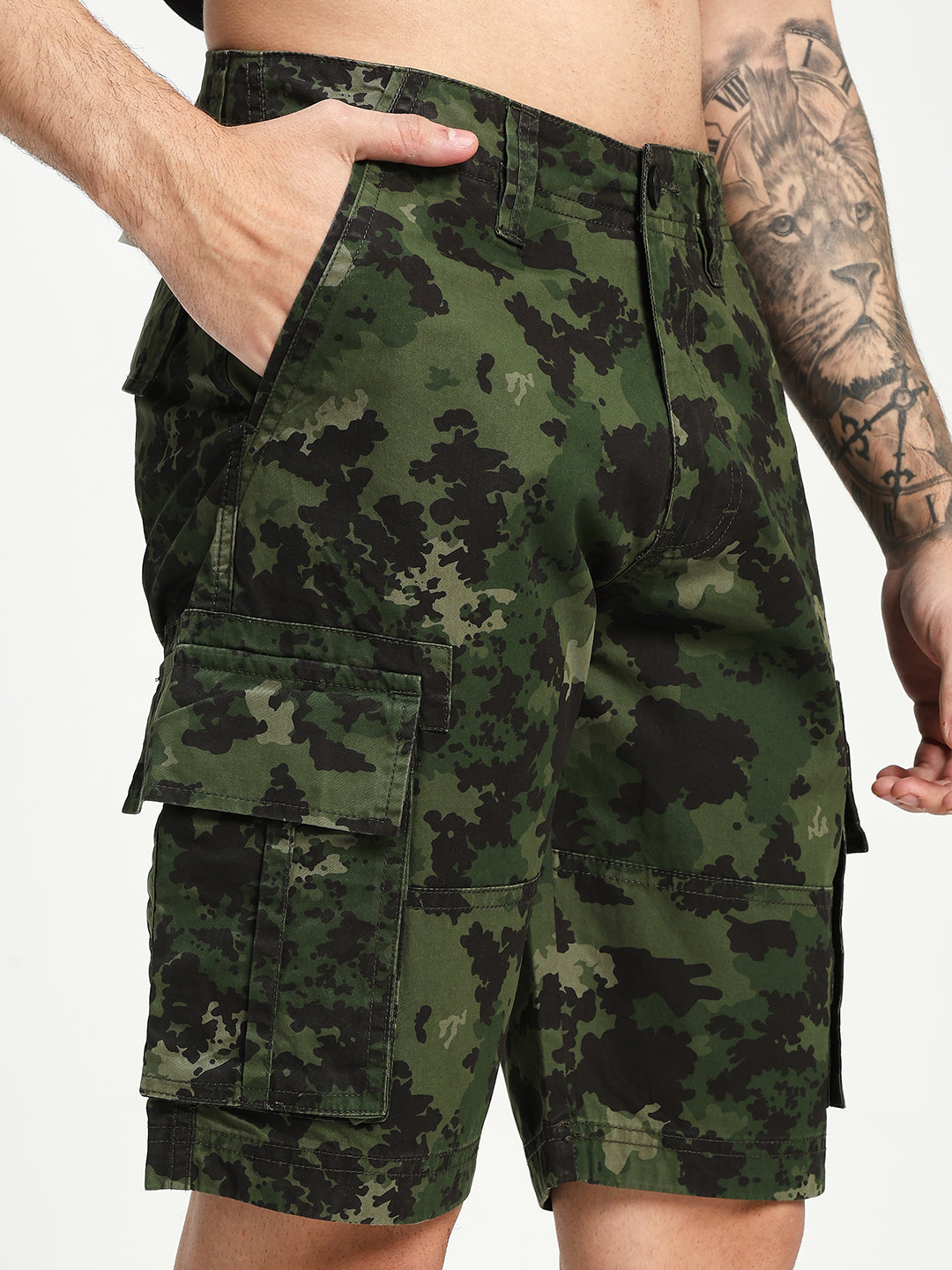 Camouflage shorts worn by a man on a white background