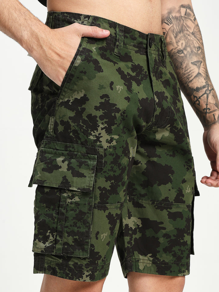 Camouflage shorts worn by a man on a white background