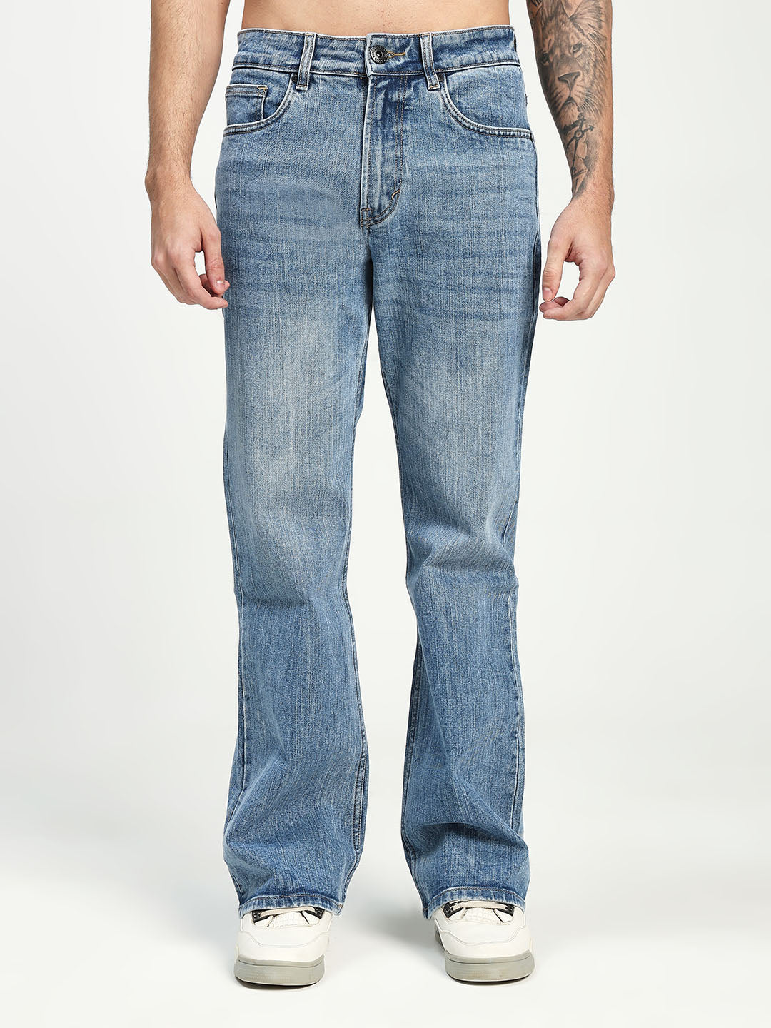 Man Wearing blue bootcut Jeans on white background 