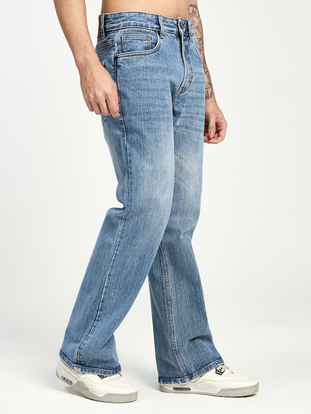 Man Wearing blue bootcut Jeans on white background 