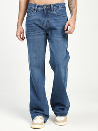 Man Wearing blue Bell Bottom Jeans on white background 