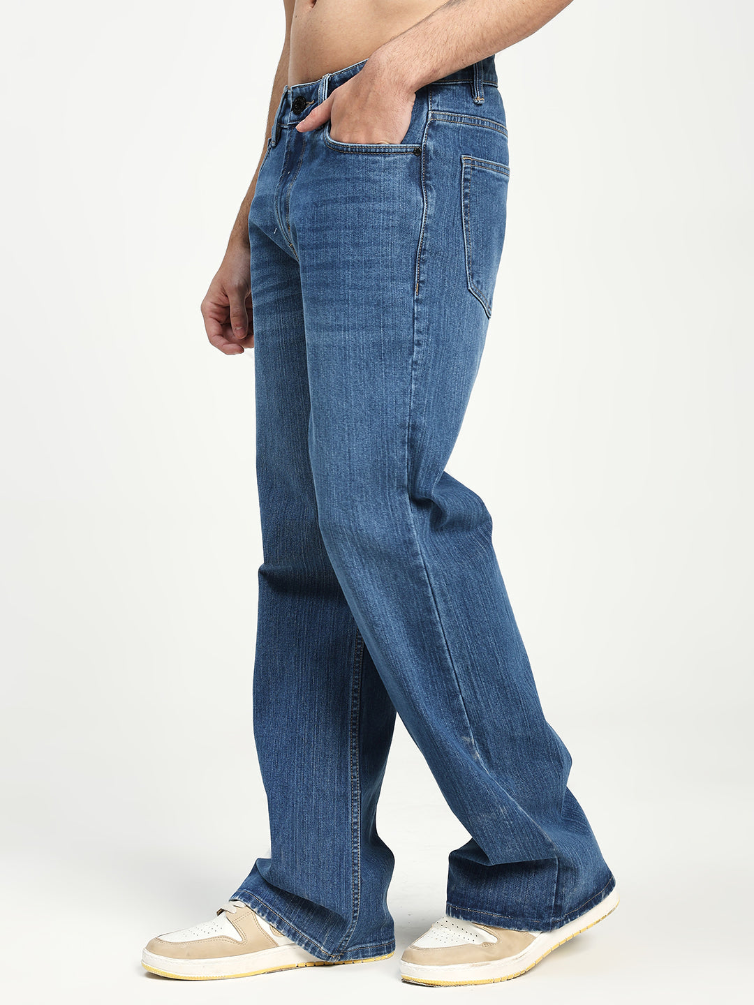 Man Wearing blue Bell Bottom Jeans on white background 