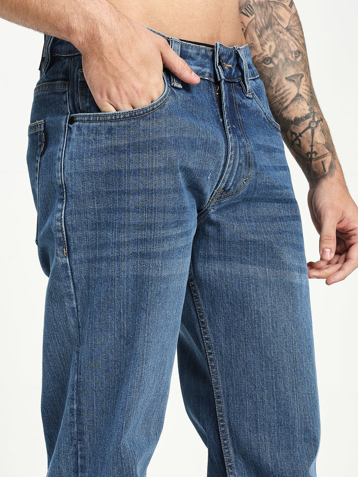 Man Wearing blue Bell Bottom Jeans on white background 