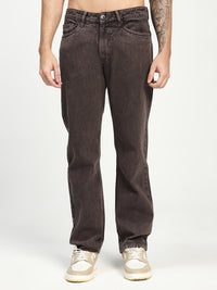 man wearing dark brown ecru eans on a white background 