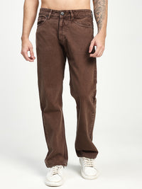 Brown ecru jeans worn by a man  on a white background