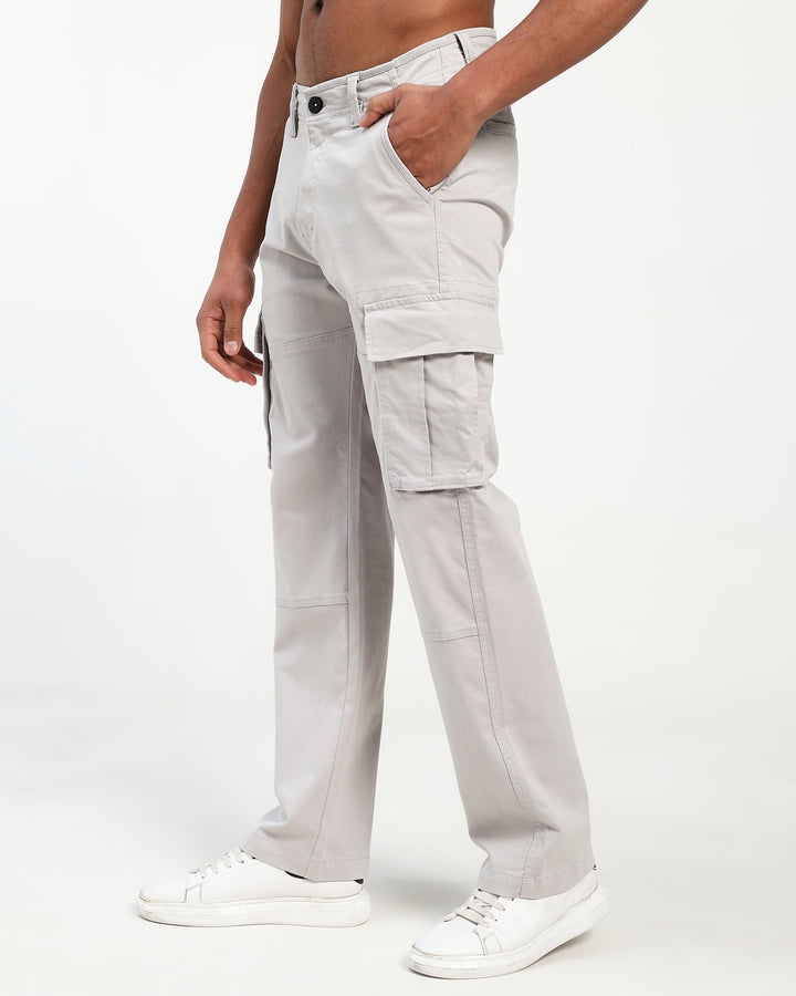 Light gray cargo pants worn by a man on a white background