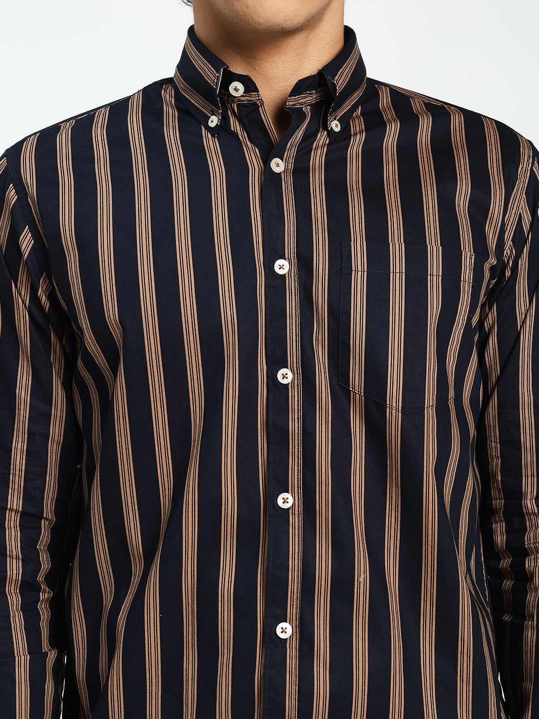 navy blue and brown striped shirt worn by a person on a white background