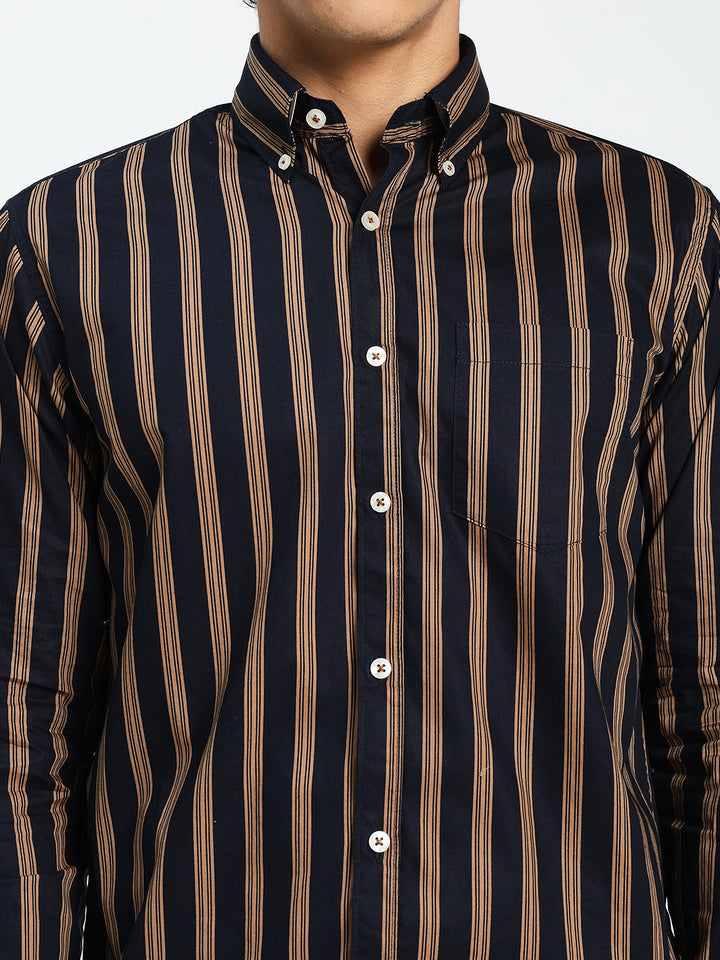 navy blue and brown striped shirt worn by a person on a white background