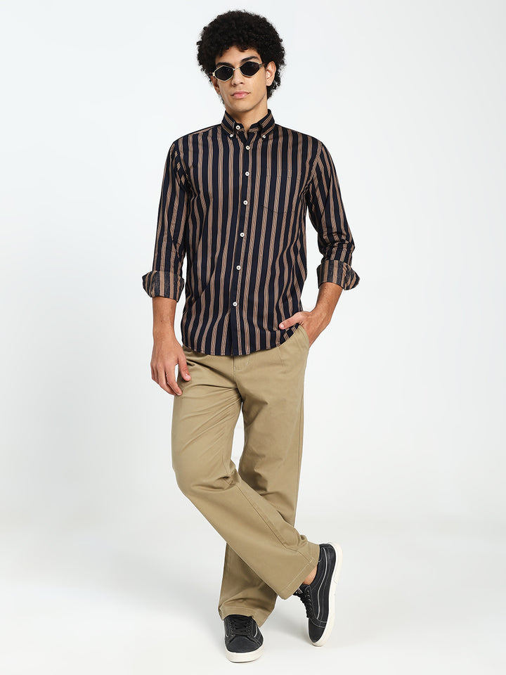 Man Wearing navy blue and Brown Striped Shirt With Beige Color pant