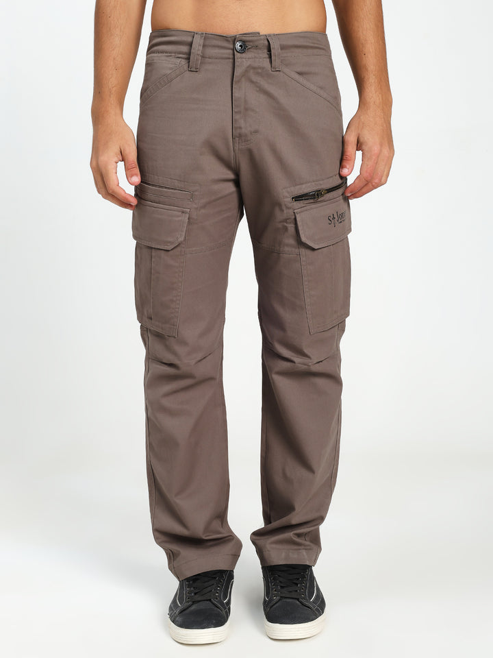 Brown cargo pants worn by a man on a white background