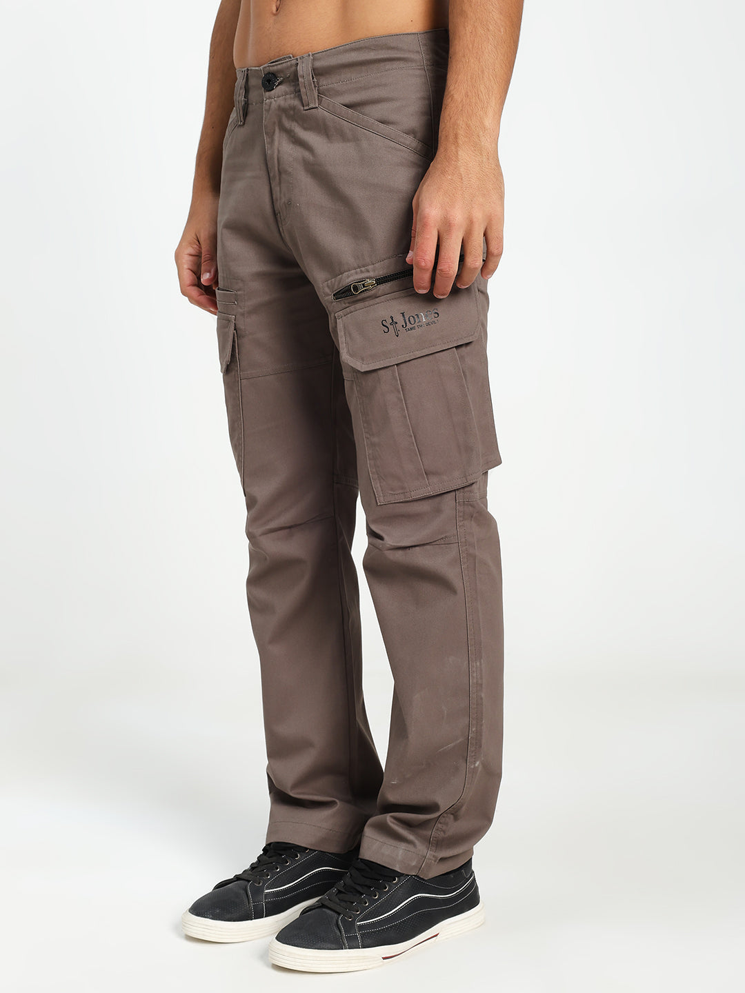 Brown cargo pants worn by a man on a white background