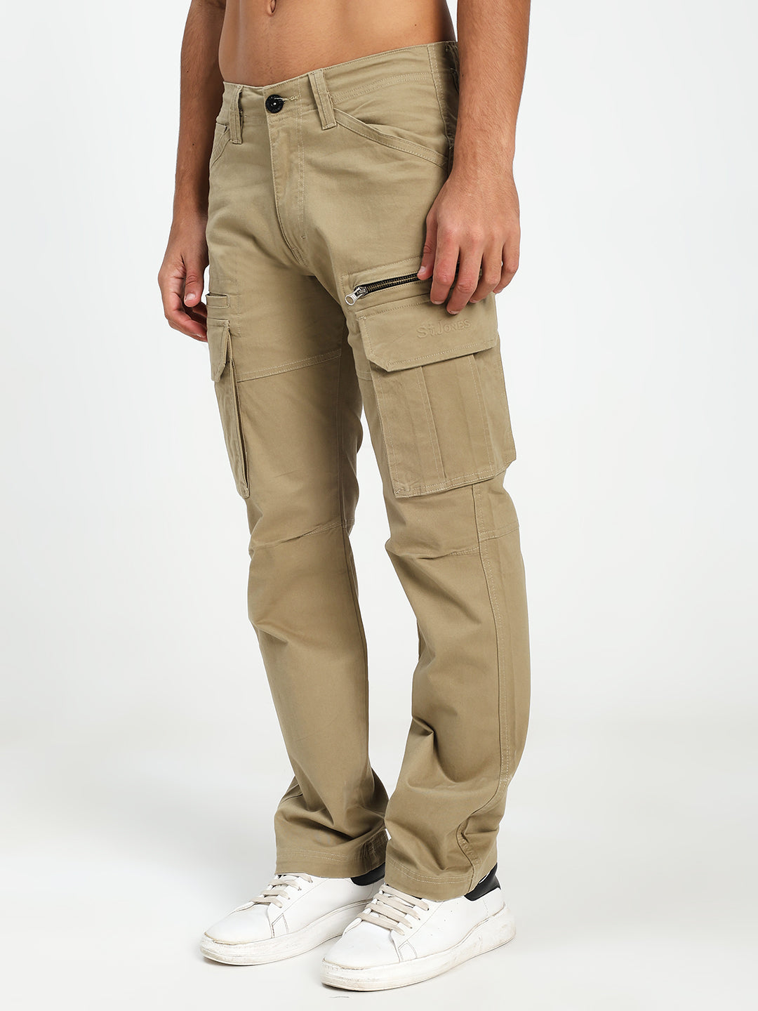 Beige cargo pants worn by a man on a white background