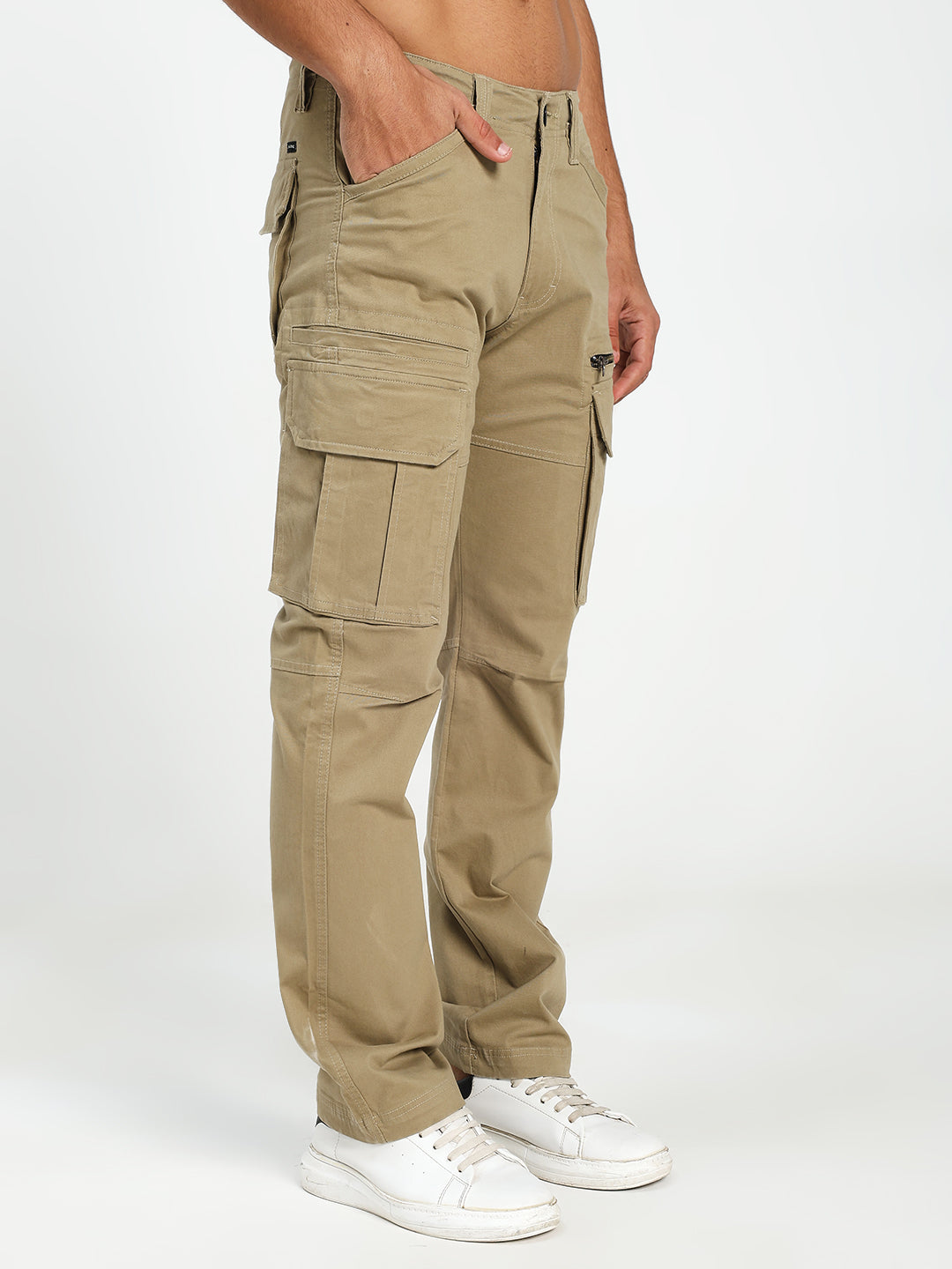 Beige cargo pants worn by a man on a white background