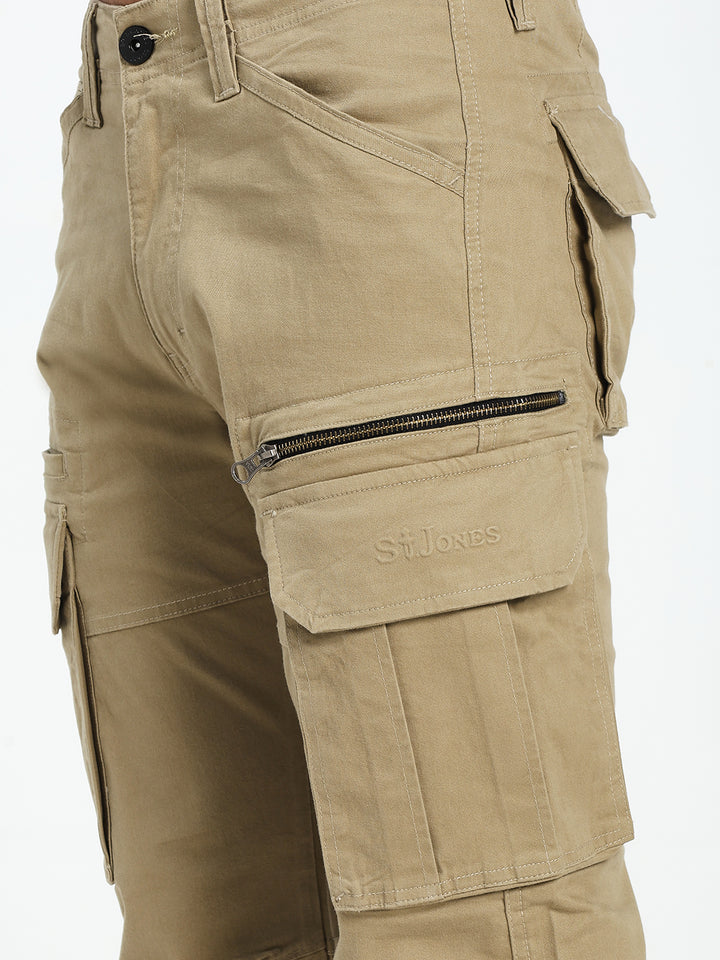 Beige cargo pant with multiple pockets and zippers on a white background