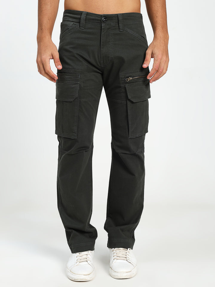 man wearing dark green cargo pants on a white background