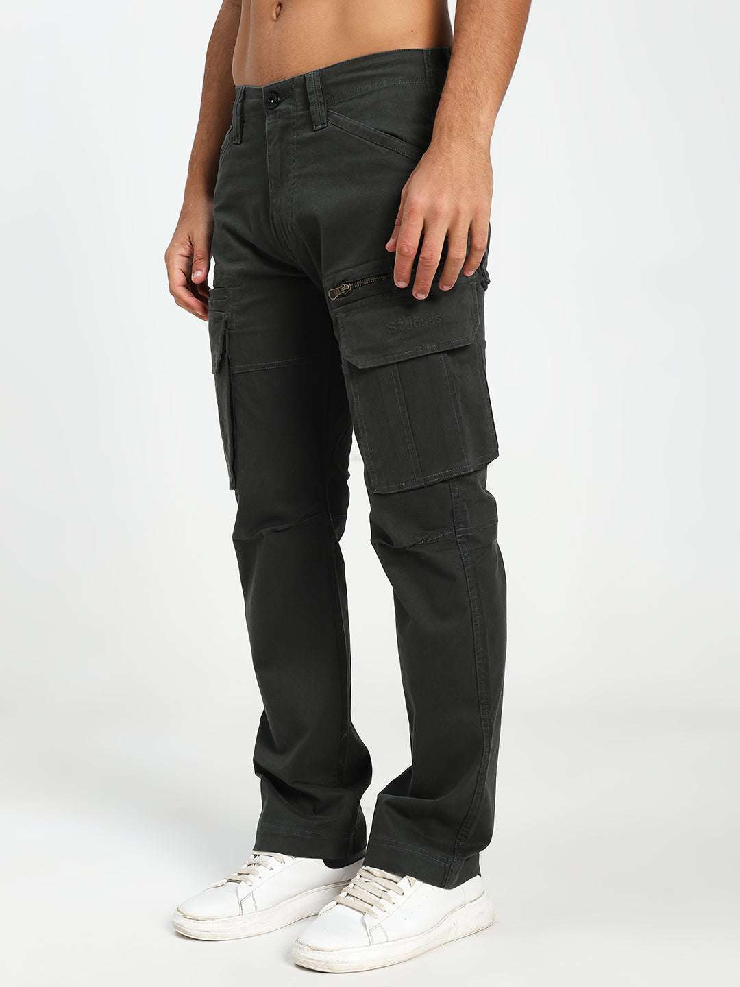 man wearing dark green cargo pants on a white background