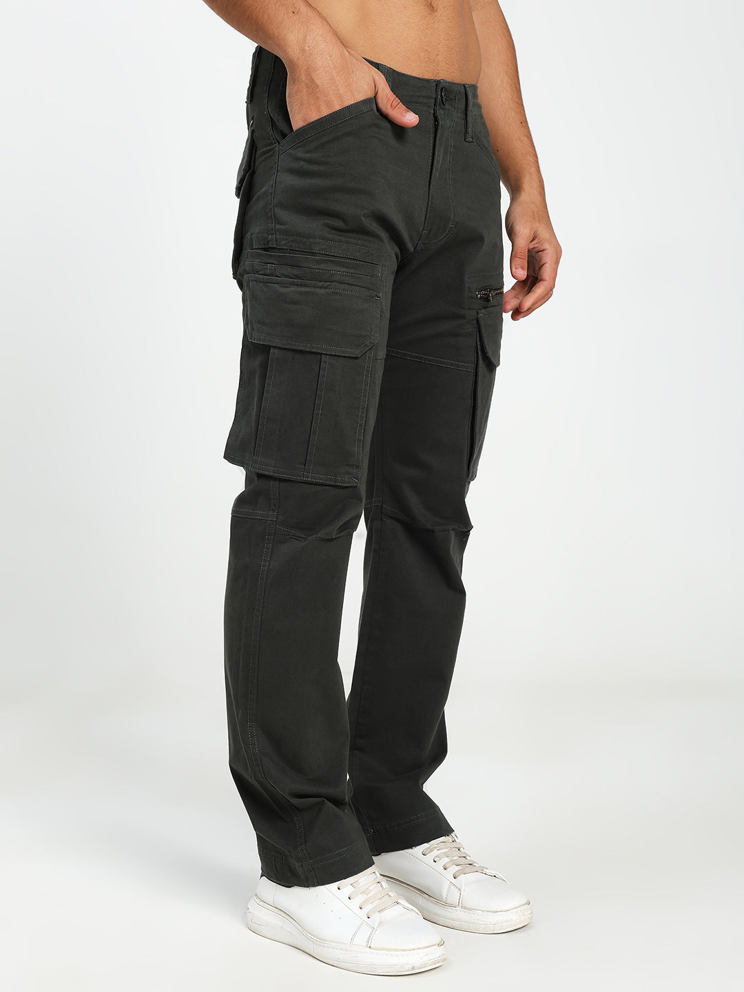 man wearing dark green cargo pants on a white background
