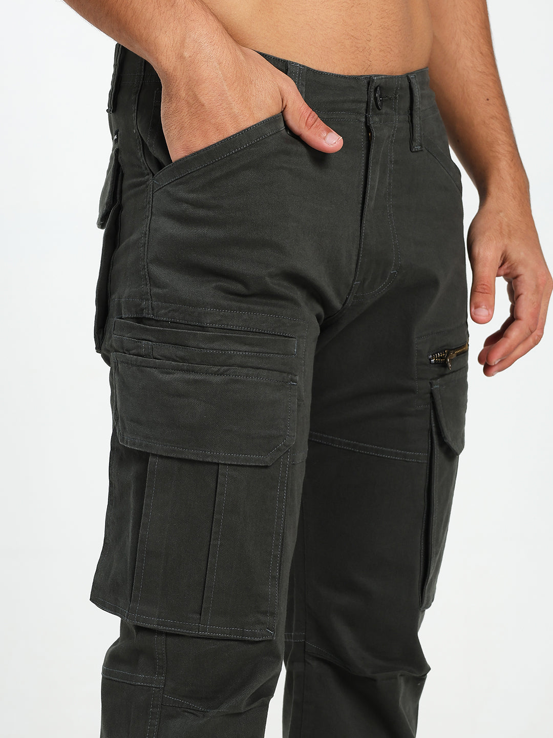 dark green cargo pants worn by a man on a white background