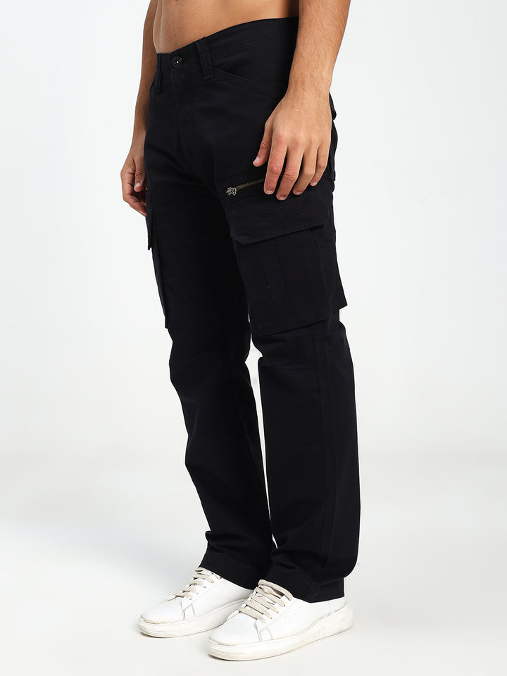 man wearing black cargo pants on a white background