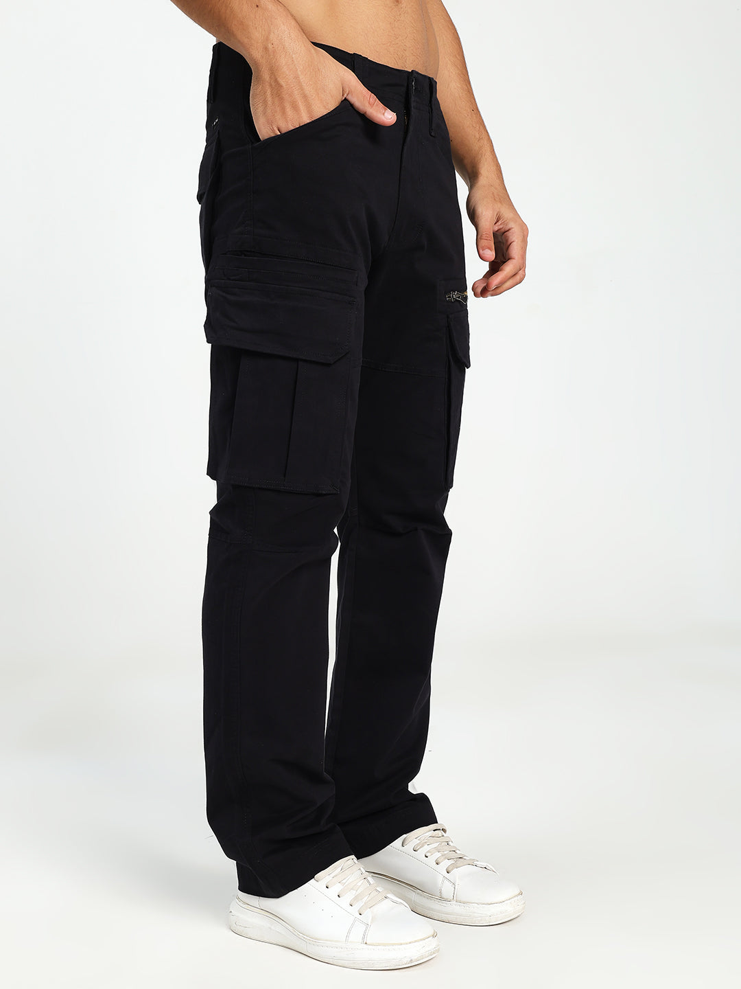 man wearing black cargo pants on a white background