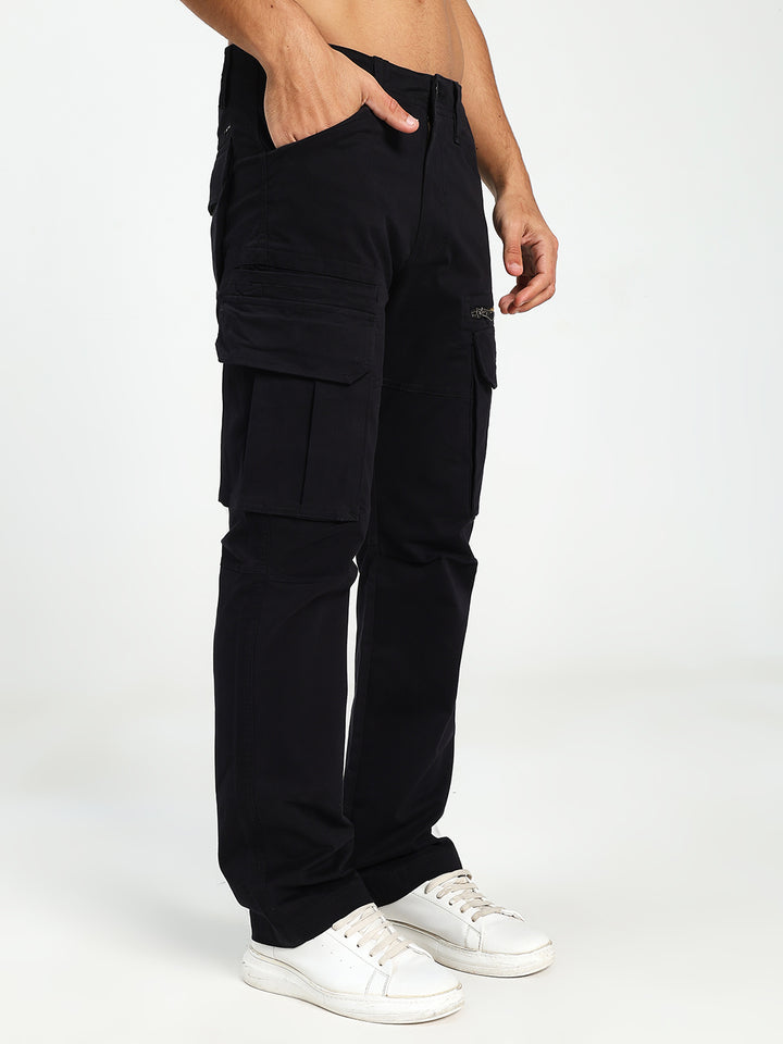 man wearing black cargo pants on a white background