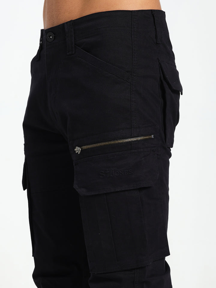 Black cargo pant with multiple pockets and zippers on a white background