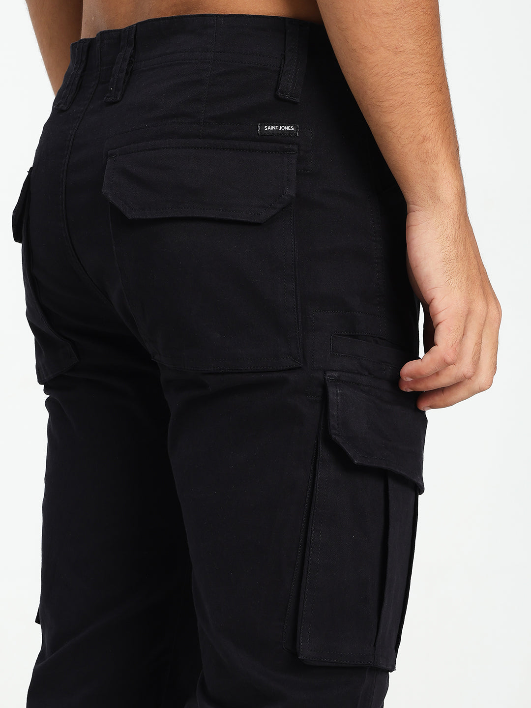 Black cargo pants with multiple pockets on a white background