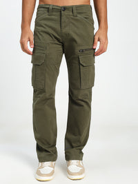 olive Green cargo pants worn by a man on a white background