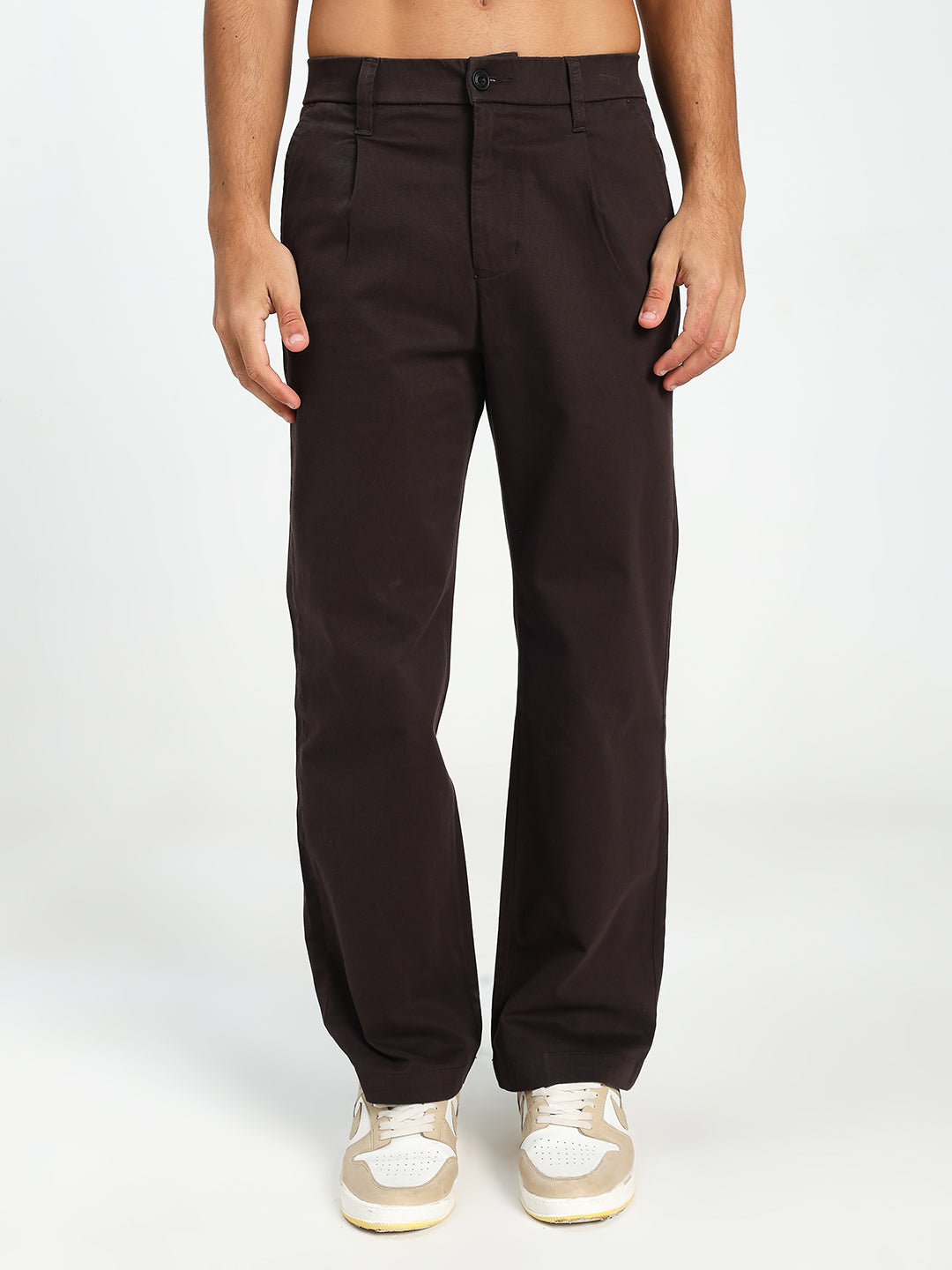 Man wearing Dark brown korean pants on a white background