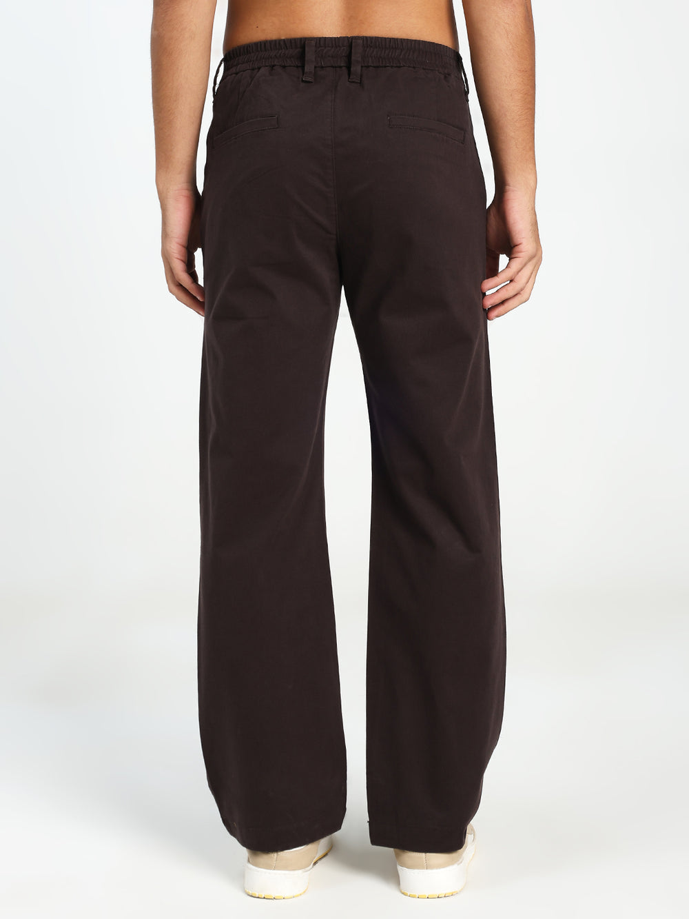 man wearing Dark Brown wide-leg Korean pants on a white background