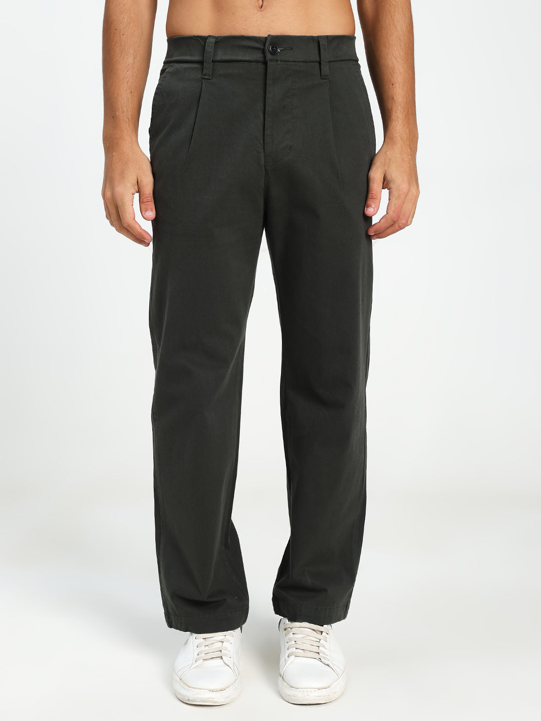 Man wearing Dark Green Korean pants on a white background