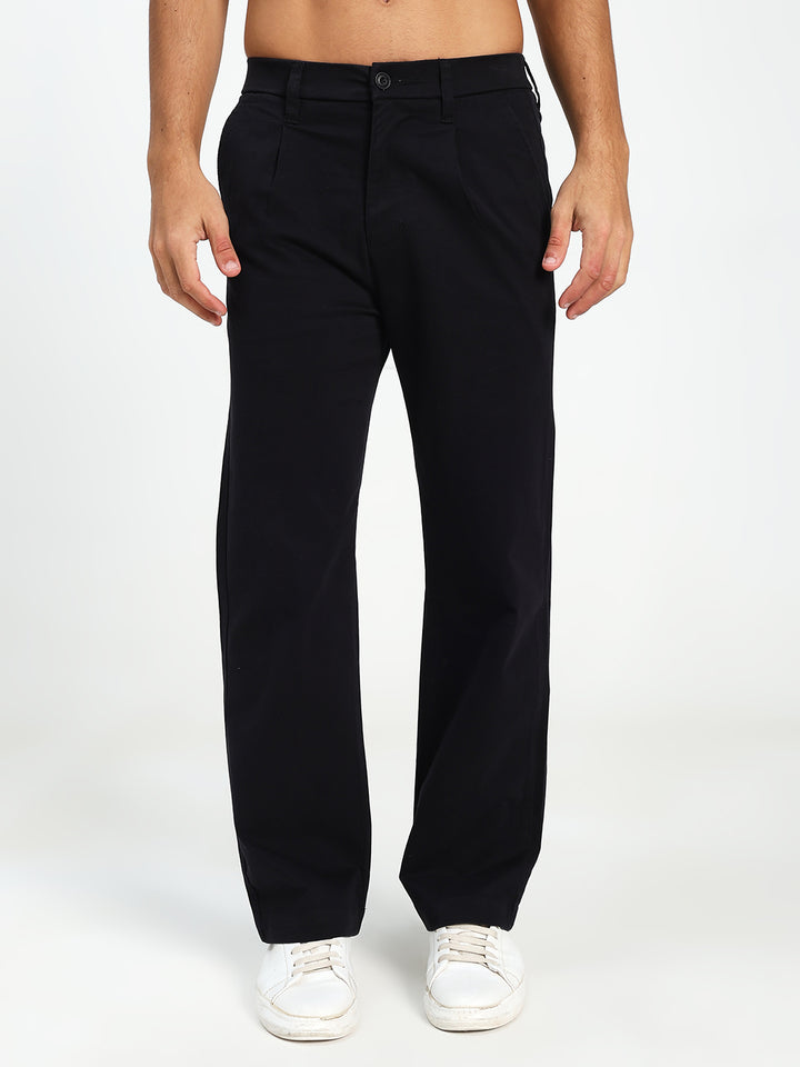 Man wearing black Korean pants on a white background