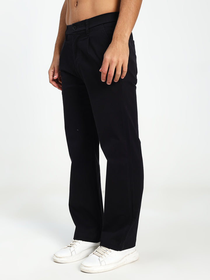 Man wearing black Korean pants and white sneakers on a white background