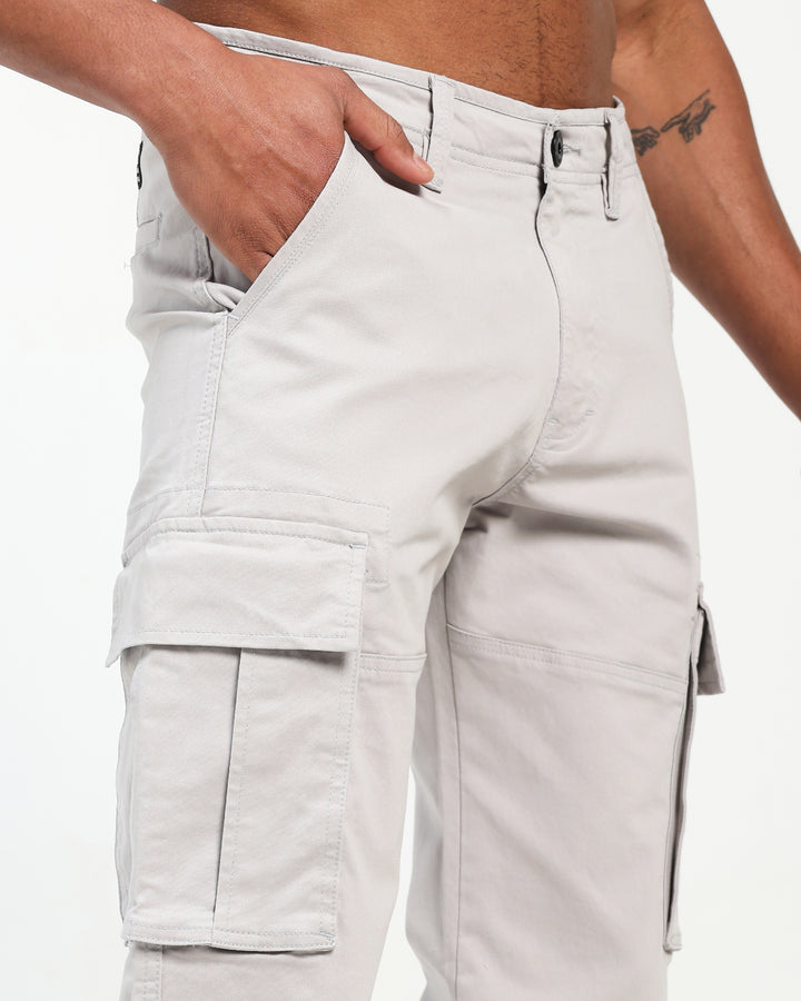 Light gray cargo pant worn by a man on a white background