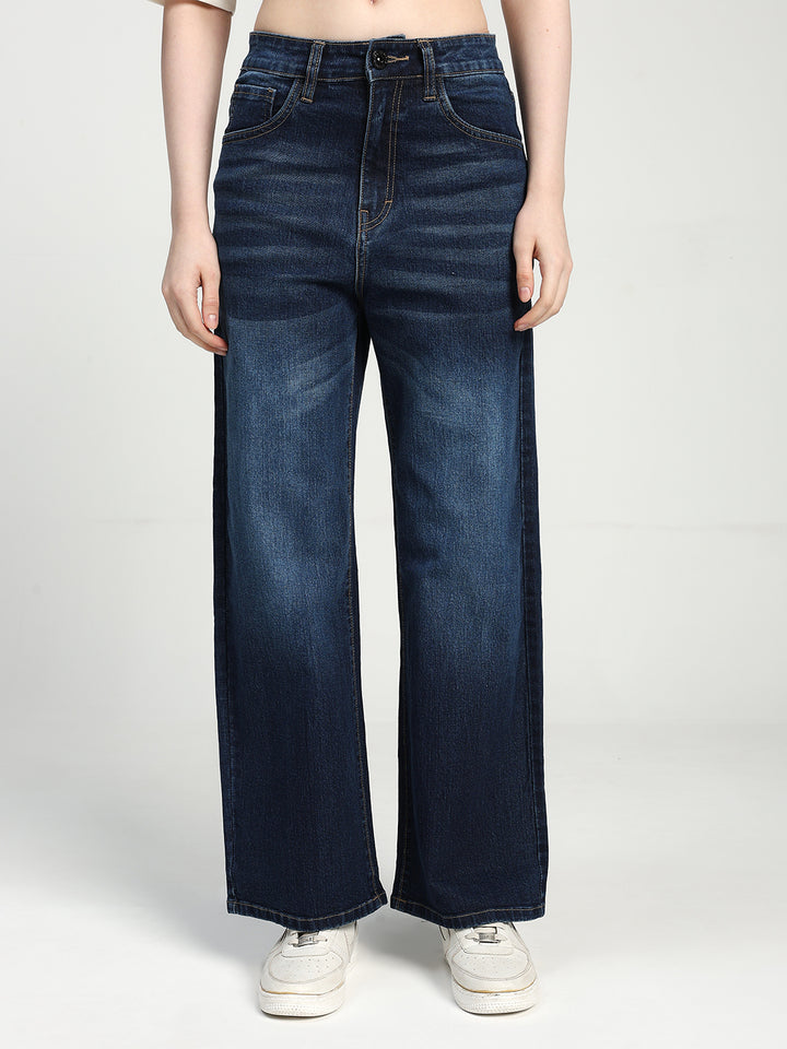 women wearing blue wide-leg jeans on a white background