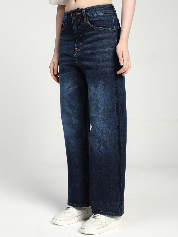 women wearing blue jeans on a white background