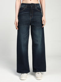 women wearing dark blue wide-leg jeans on a white background