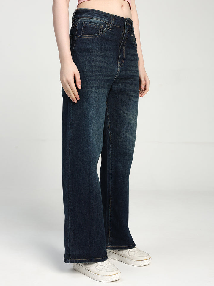 dark blue jeans worn by a women on a white background