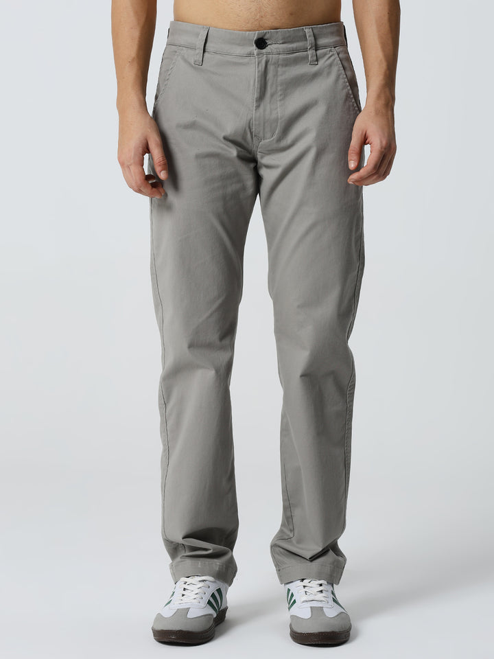 man wearing gray pants on a white background