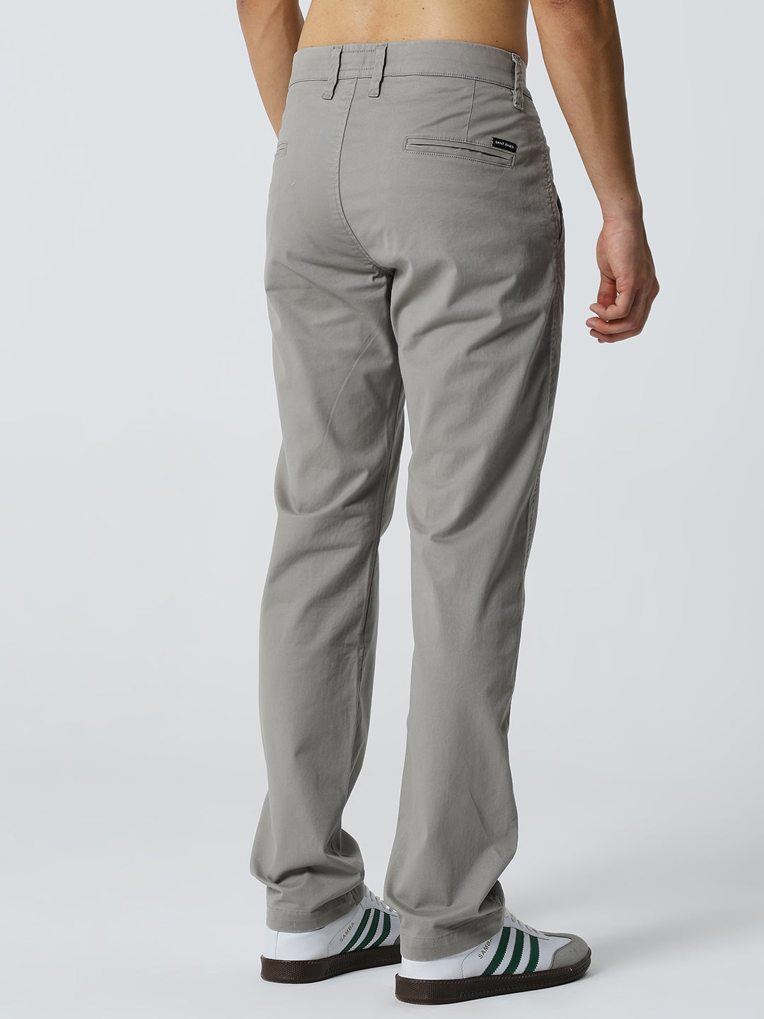 Gray pants worn by a man on a white background