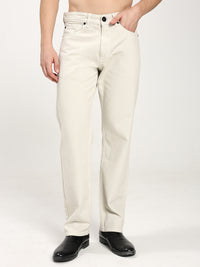 man wearing off-white jenas and black shoes on a white background