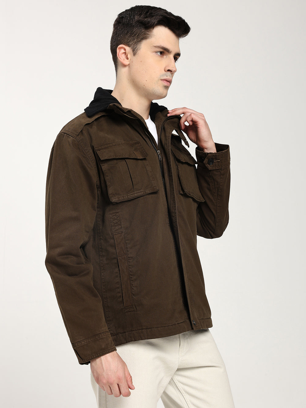 Man wearing a brown jacket with a white background