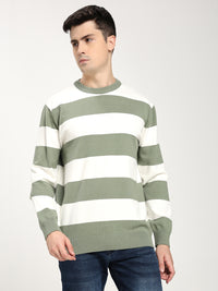 Man wearing a green and white striped sweater on a plain background