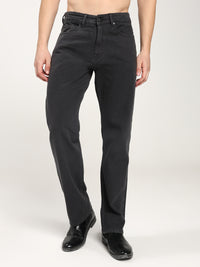 man wearing black jeans on a white background