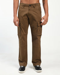 Brown cargo pants worn by a man on a white background
