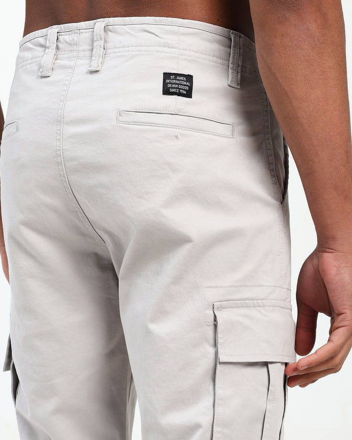 Light gray cargo pants with a saint jones label on a white background