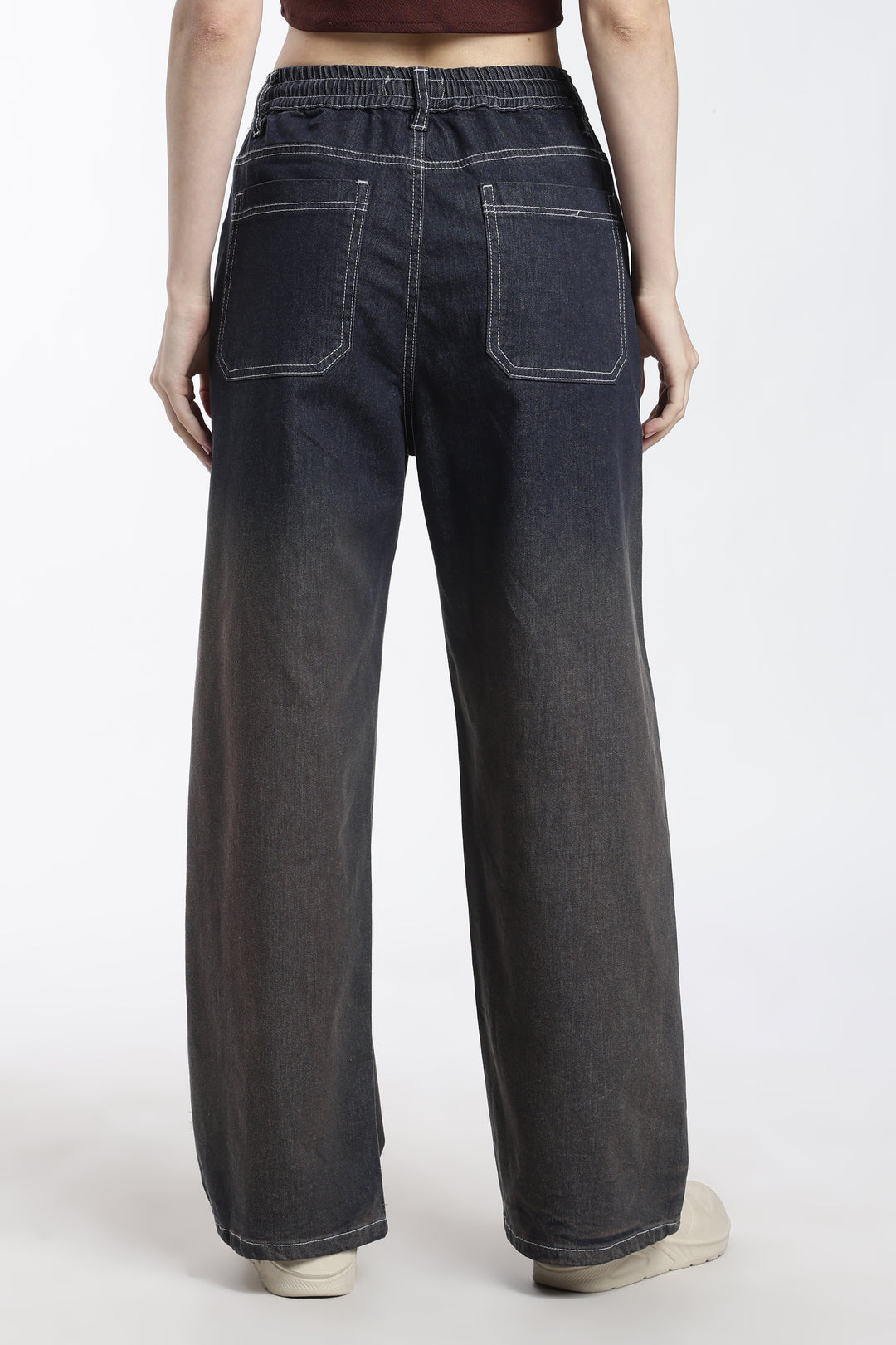 woman wearing vintage wash wide-leg jogger on a white background